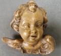 Rzeźbiona głowa w drewnie - Aniołek cherubinek