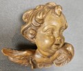 Rzeźbiona głowa w drewnie - Aniołek cherubinek