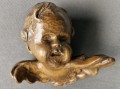 Kupidynek cherubinek - Rzeźbiona głowa w drewnie