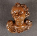 Uskrzydlone putto patrzące w prawo - Rzeźba ręcznie wykonana