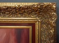 Całość oprawiona w okazałą, złoconą ramę snycerską z bordowym wykończeniem.