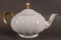 dzbanek z wysokiej jakości białej, lśniącej porcelany o szlachetnym odcieniu.